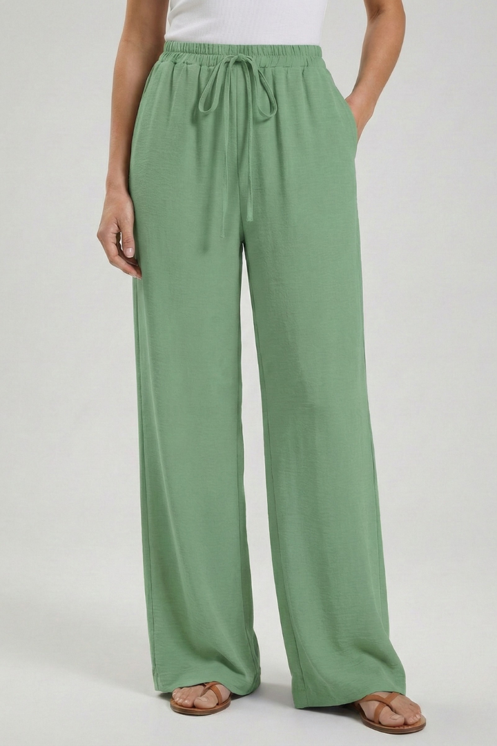 Flowy women's wide-leg trousers, palazzo style, with an adjustable drawstring and pockets.