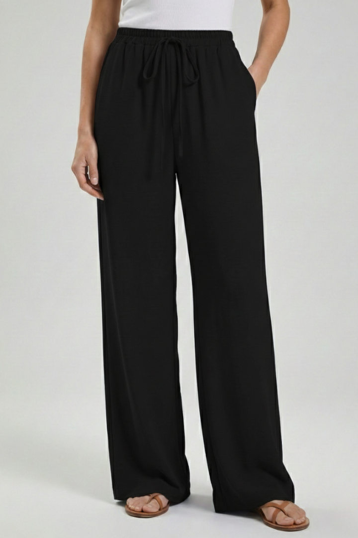 Women's fashion palazzo trousers, soft fabric, drawstring waist, and essential pockets.