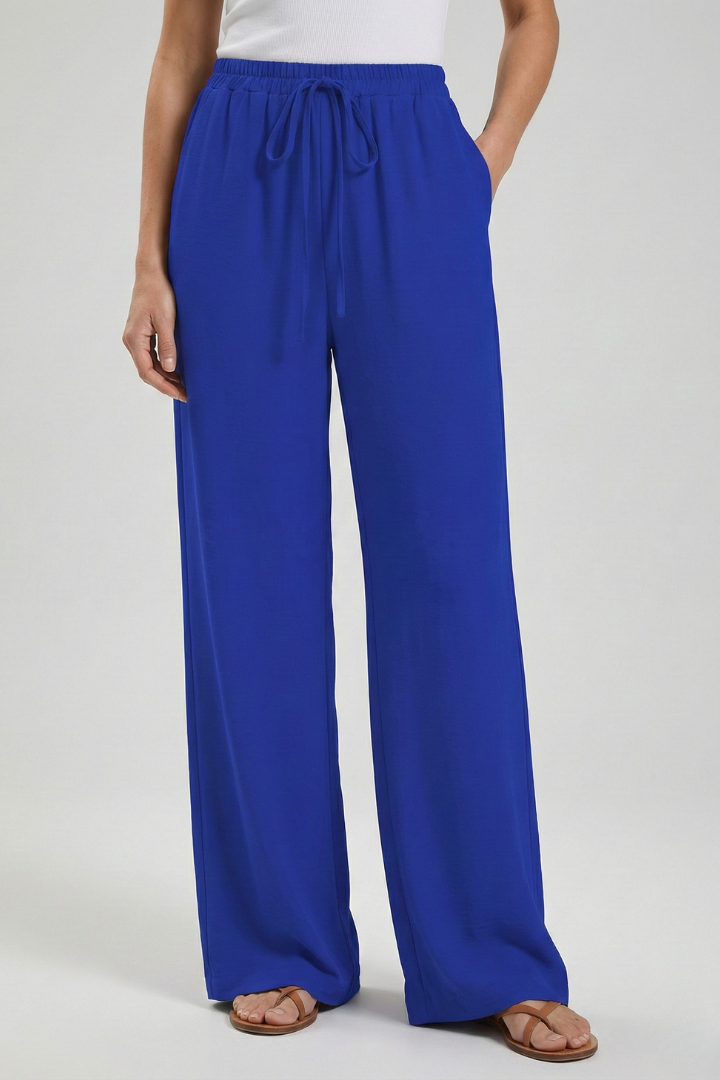 Comfortable women's palazzo pants, wide-leg, drawstring, perfect for a vacation outfit.