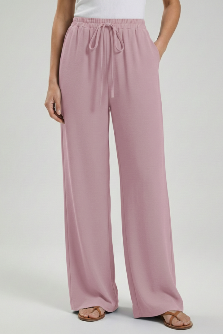 Fashionable women's palazzo pants, comfortable fit with drawstring waist & side pockets.