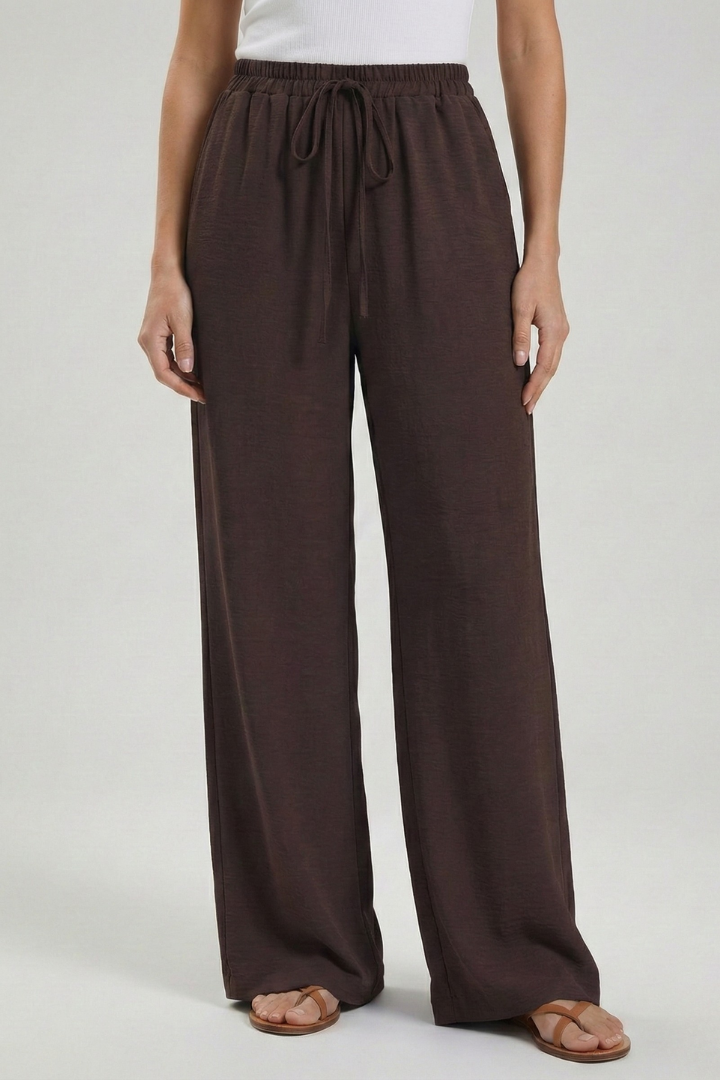 Lightweight women's palazzo trousers, wide-leg, drawstring waist, great for summer fashion.