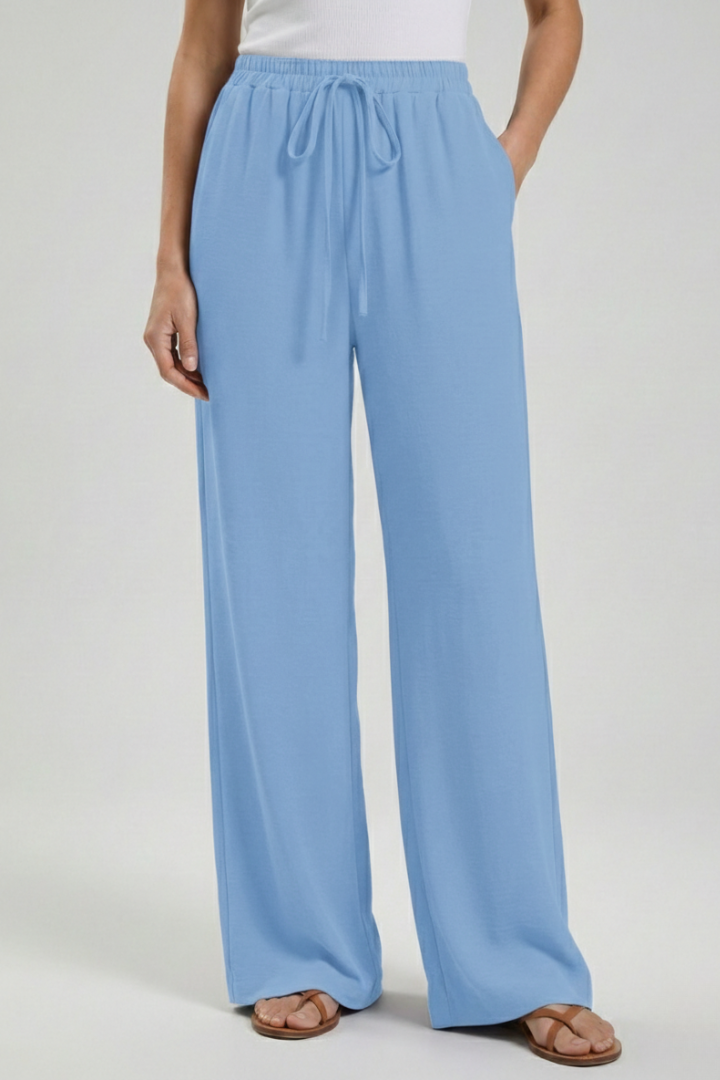Women's comfortable palazzo pants, featuring wide legs, drawstring, and practical pockets.