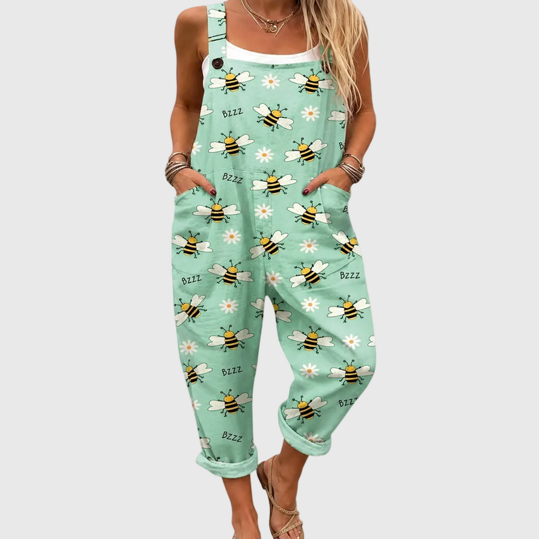 Women's pastel green jumpsuit with bee & daisy pattern. Comfortable, lightweight & relaxed fit for casual summer style.