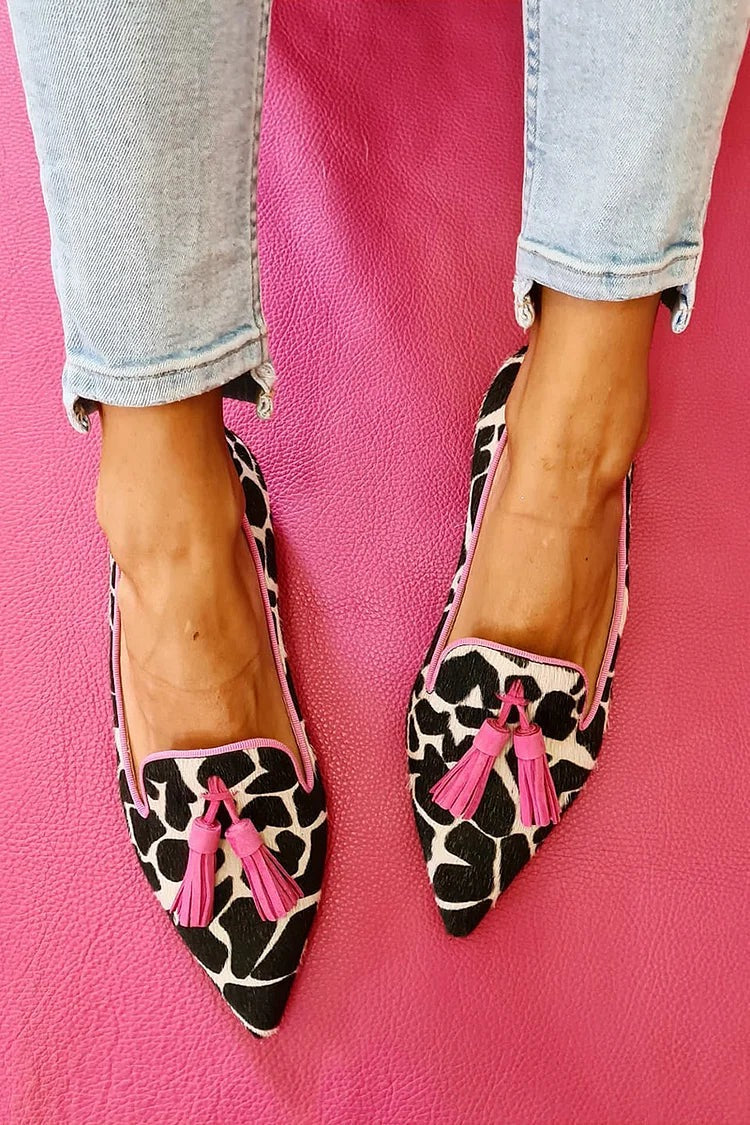 Vibrant patterned women's loafers with playful tassels. Comfortable, stylish slip-on flat shoes for casual looks.