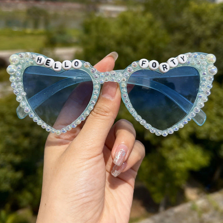 Women's pearl cat-eye sunglasses offering stylish UV protection for a chic look.