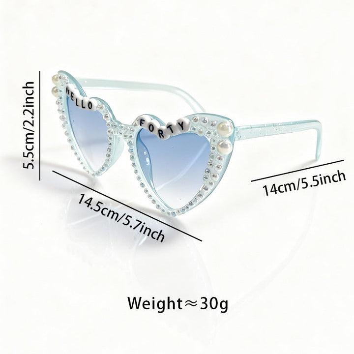 Chic women's cat-eye sunglasses with elegant pearl embellishments and essential UV protection.