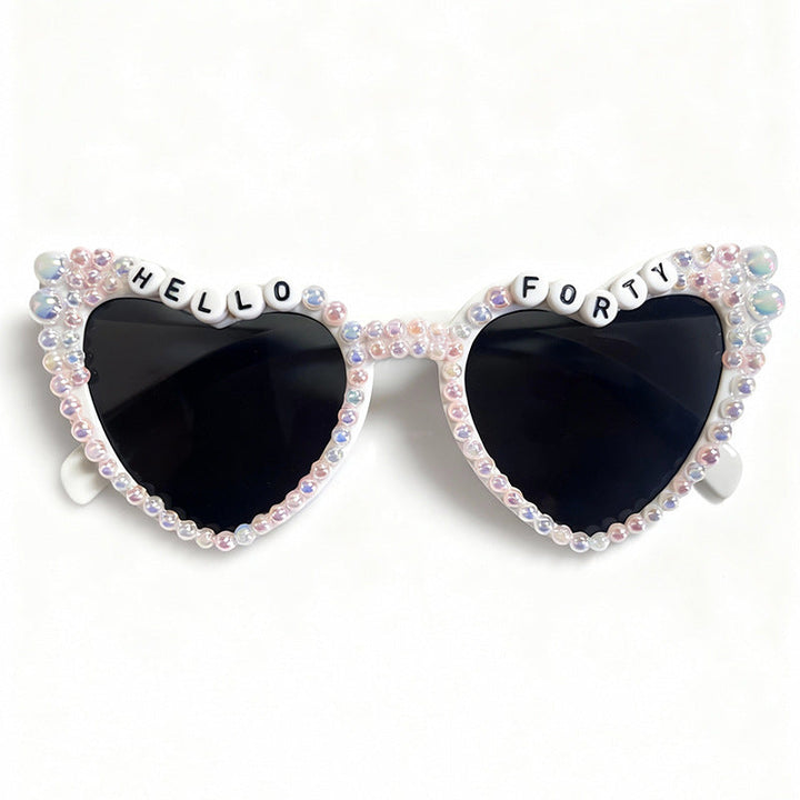 Elegant women's cat-eye sunglasses featuring sophisticated pearl details, providing full UV protection.