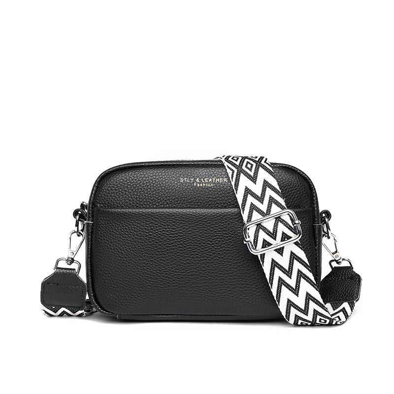 Stylish women's pebbled leather crossbody handbag, a chic accessory with an adjustable shoulder strap for fashion.