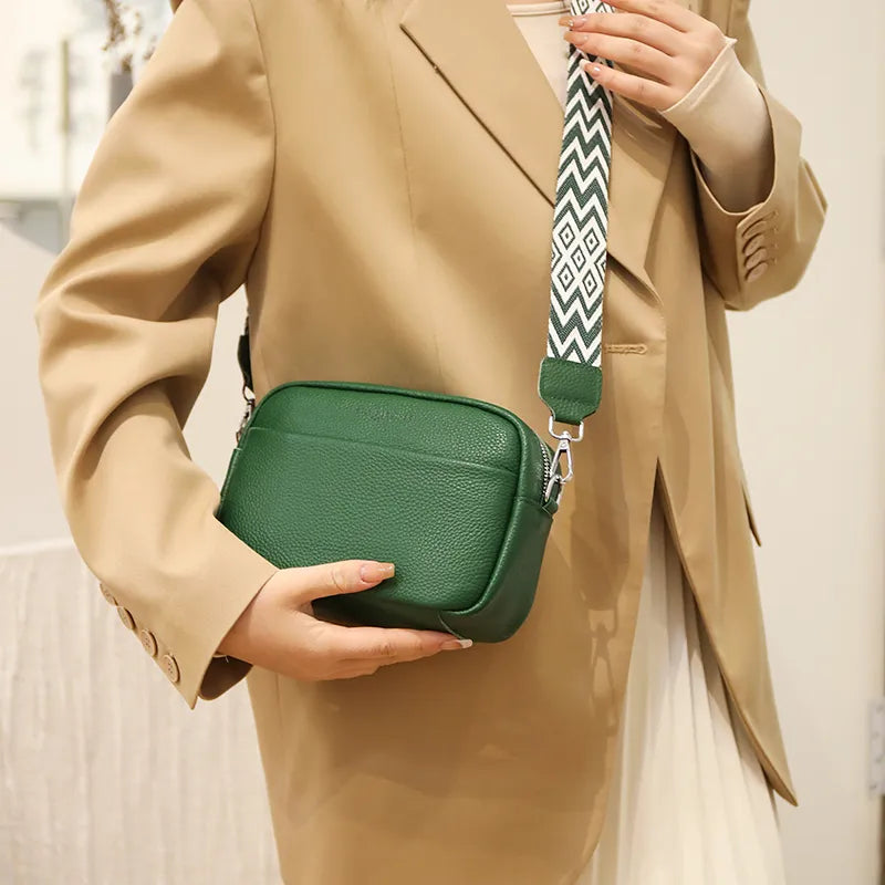 Versatile women's leather crossbody bag, featuring pebbled texture and an adjustable strap for daily wear & convenience.