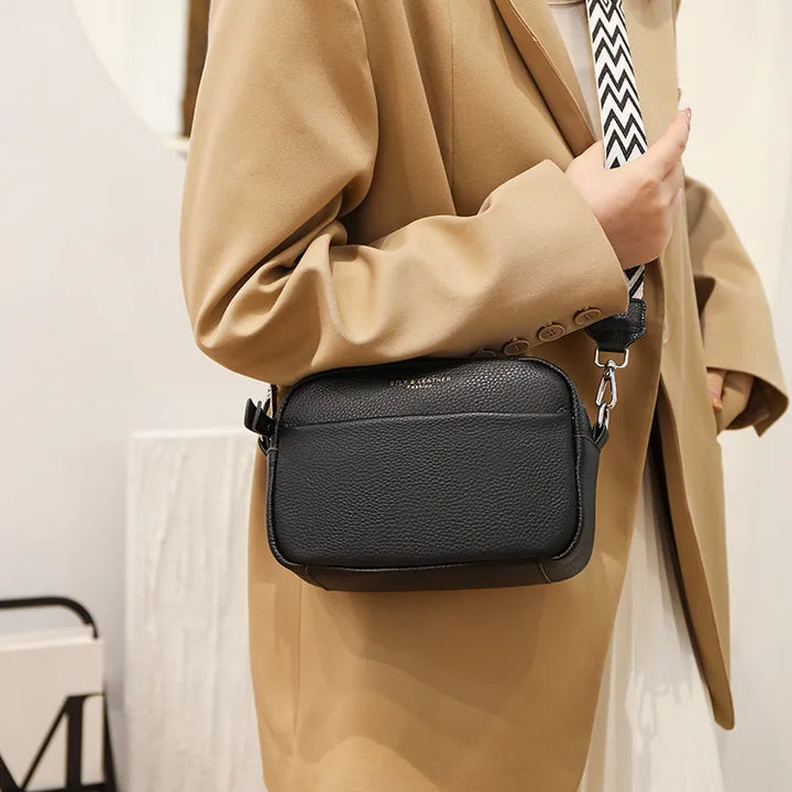 Elegant women's pebbled leather crossbody bag. Fashionable & practical handbag with adjustable strap for accessories.