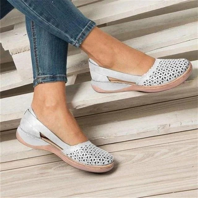 Comfortable women's slip-on wedge sandals with stylish perforated & cutout design. Round toe for summer.