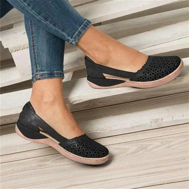 Casual women's perforated wedge sandals with round toe & side cutouts. Ideal for summer fashion.