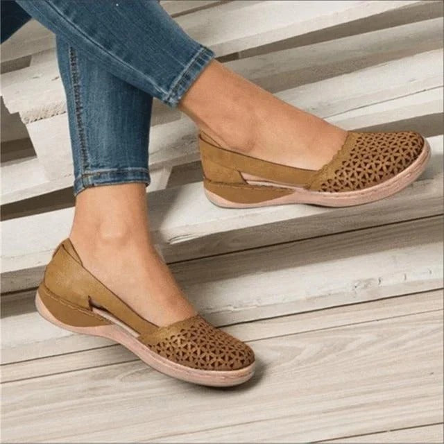 Breathable perforated round toe wedge sandals for women, offering comfortable slip-on summer style.