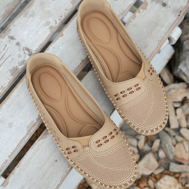 Effortless women's slip-on loafers, perforated design for breathable summer comfort & everyday wear.