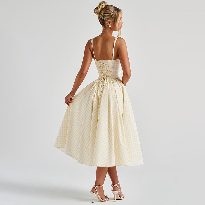 Stylish yellow checkered midi dress for women, with a modern square neck and feminine princess silhouette.