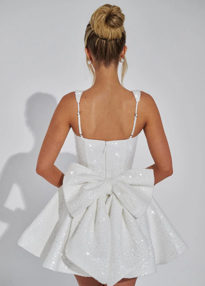 Beautiful flared mini dress, women's party wear, with a charming bow accent and square neckline.
