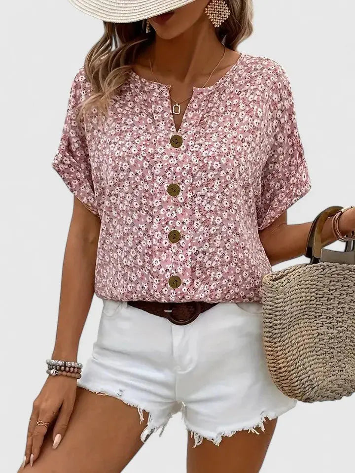 Women's pink floral print short sleeve blouse with button front, perfect for summer casual wear & feminine style.