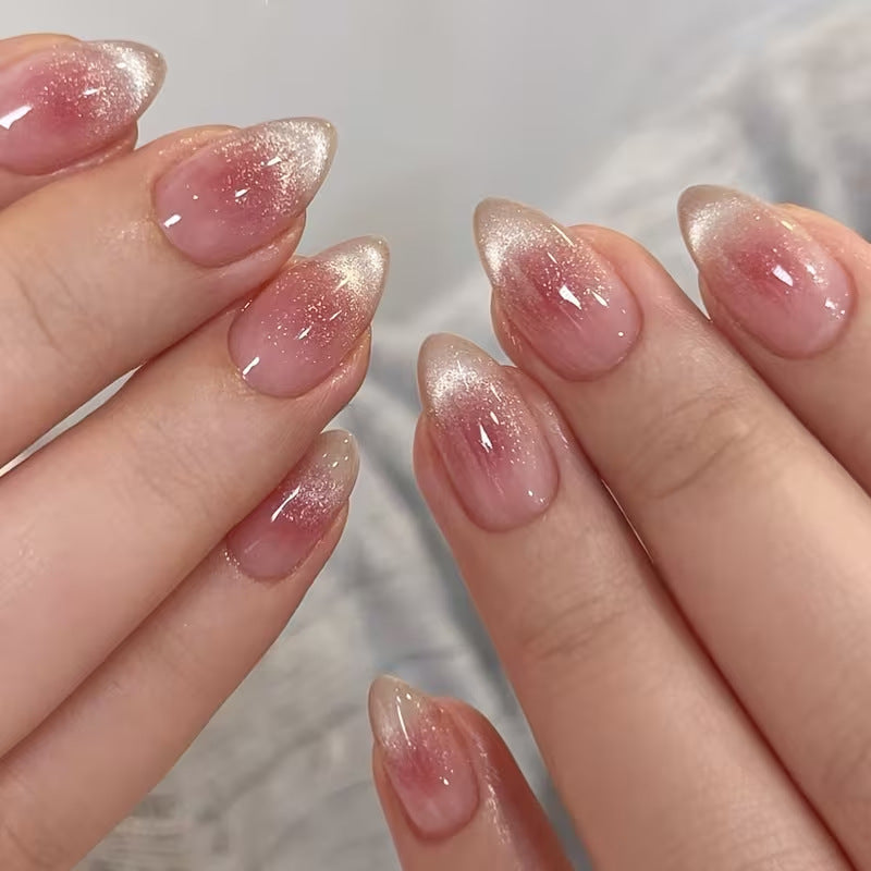 Women's pink glitter French tip press-on nails for a stylish, quick manicure.