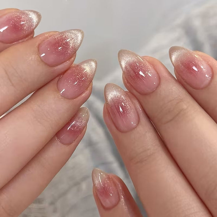 Women's pink glitter French tip press-on nails for a stylish, quick manicure.