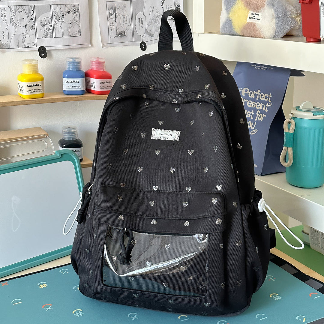 Fashionable women's casual backpack featuring a cute heart pattern, ideal for school, travel, or daily use.
