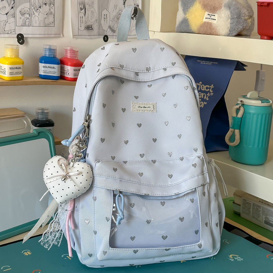 Durable women's heart-print student backpack with comfy adjustable straps, great for books & essentials.