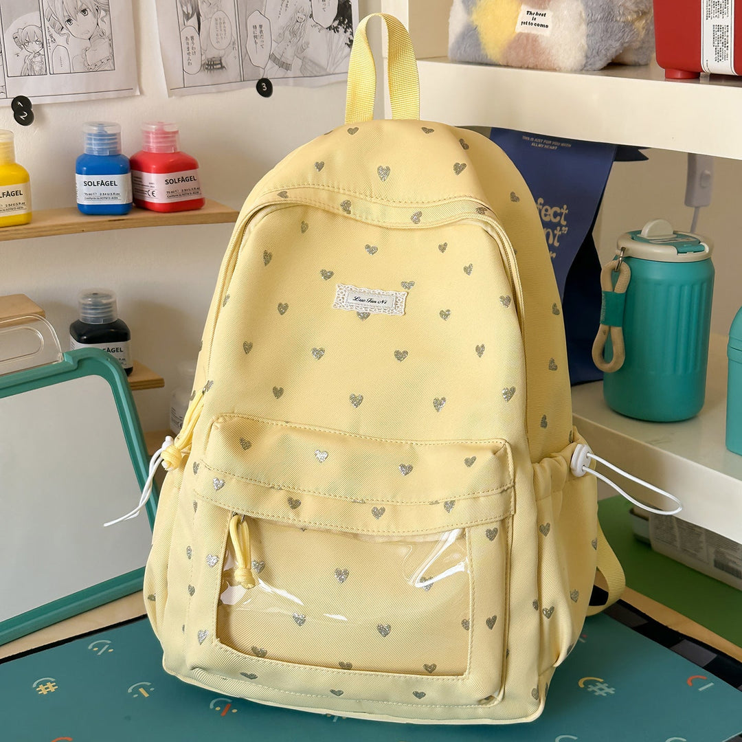 Cute heart-patterned casual backpack for women, a stylish and practical choice for school or everyday carry.