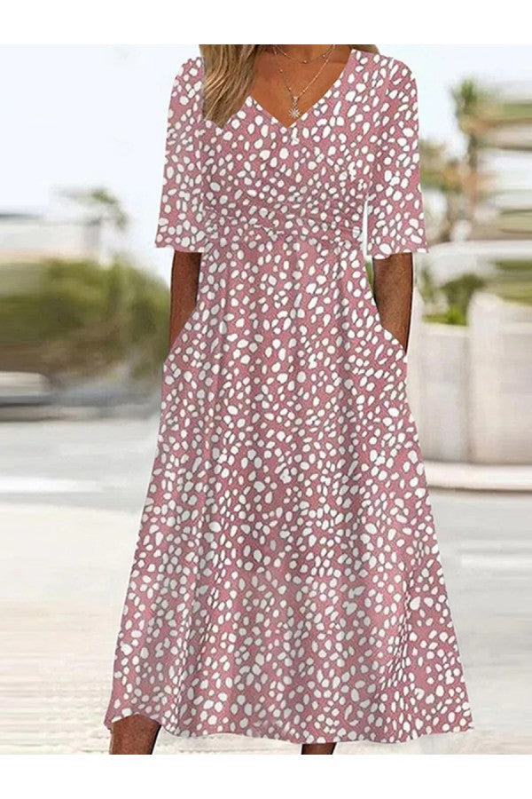 Women's pink polka dot midi dress, tummy-flattering v-neck, elegant for casual summer or spring occasions.