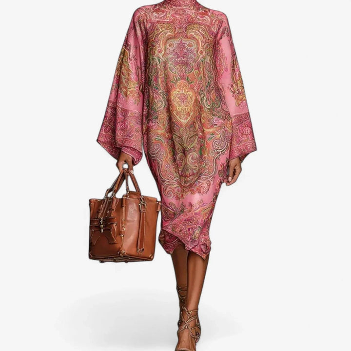 Comfortable women's printed caftan midi dress with batwing sleeves. Effortless pink summer dress for elegant casual wear.