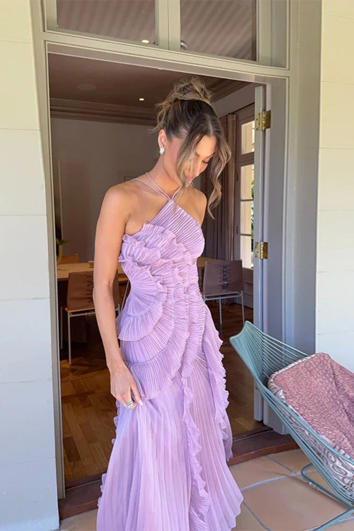 Vibrant yellow ruffled halter maxi dress, a chic and airy choice for summer vacations and outdoor events.