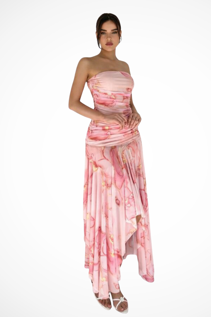 Stylish pink floral strapless maxi dress for women, featuring a flattering high-low hem for wedding guests.