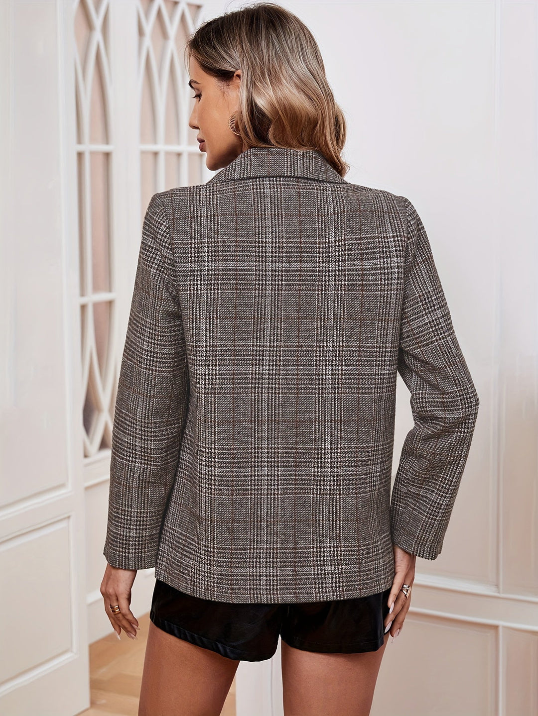 Tailored women's long sleeve plaid blazer, ideal for a chic casual look or smart office layering.
