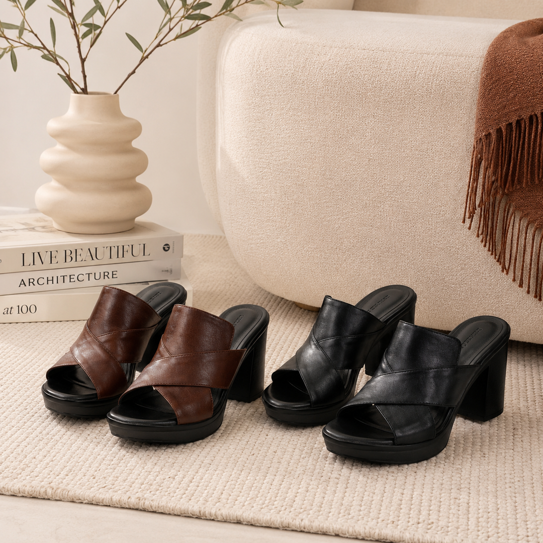 Fashionable women's platform sandals with a chunky block heel & intricate crisscross straps. Open-toe footwear.