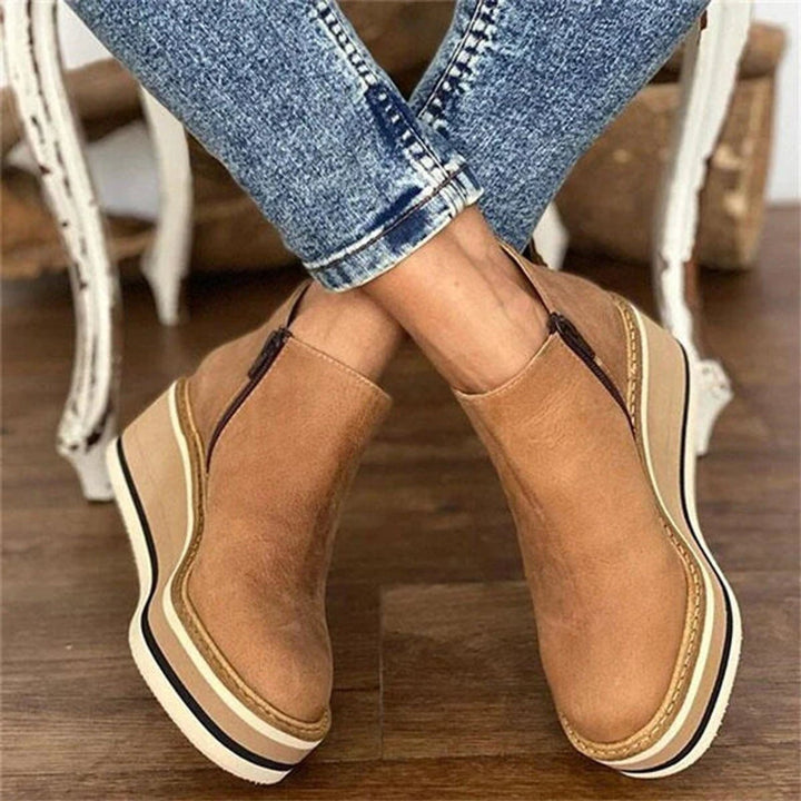 Chic women's wedge ankle boots with a comfortable platform sole & side zip, great for everyday casual wear.