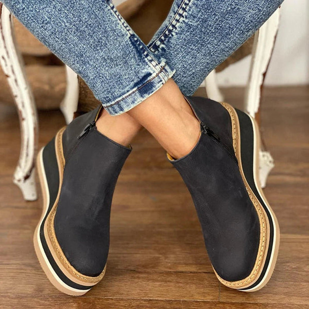 Autumn/winter women's platform wedge ankle boots, featuring a chunky sole & side zip for comfort and style.