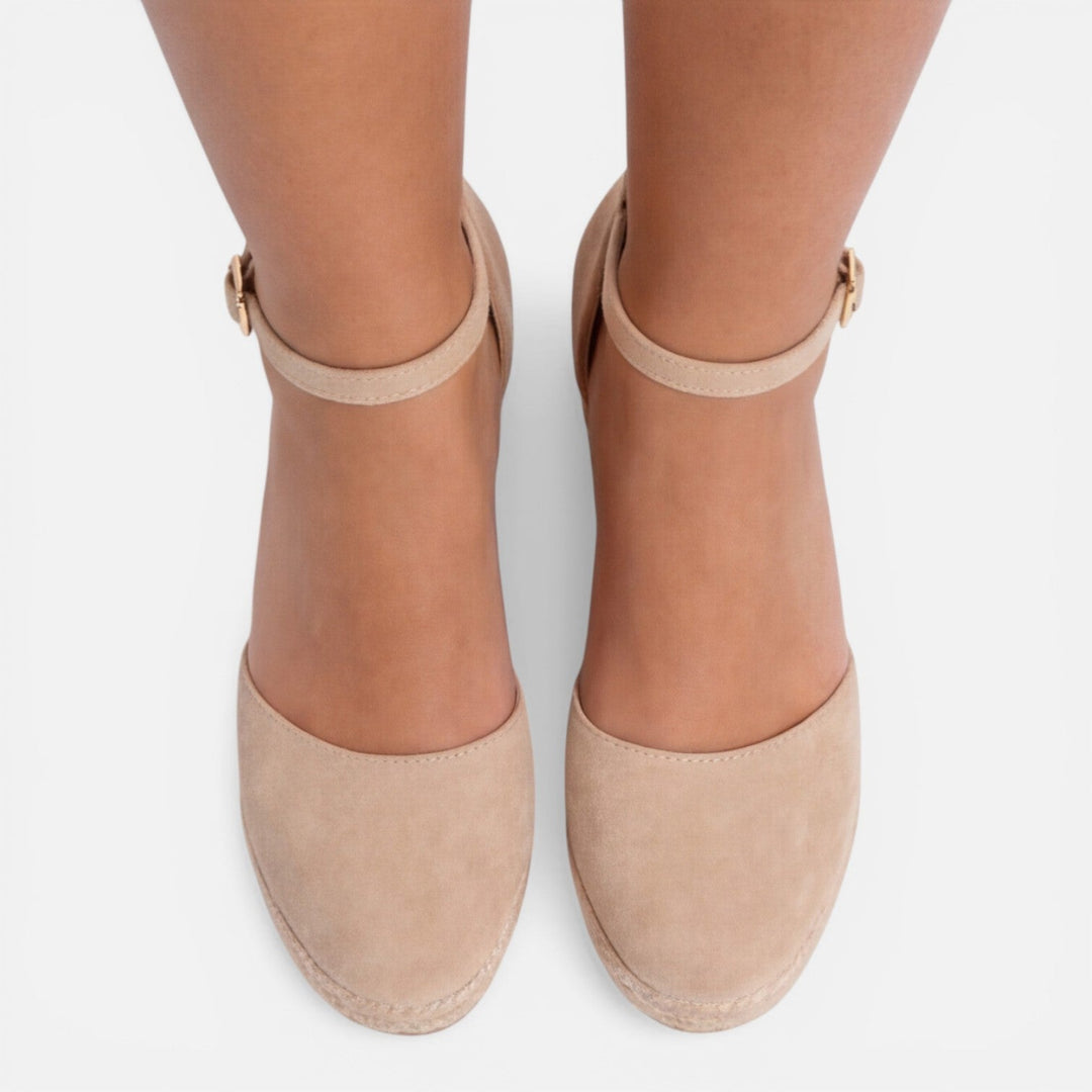 Chic espadrille wedge sandals for women, designed with a platform sole & secure ankle strap for vacation style.