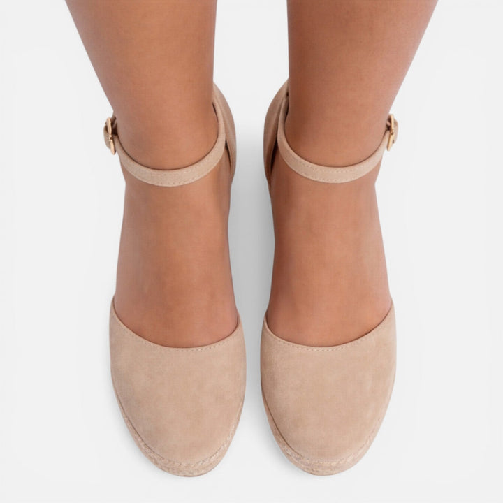 Chic espadrille wedge sandals for women, designed with a platform sole & secure ankle strap for vacation style.