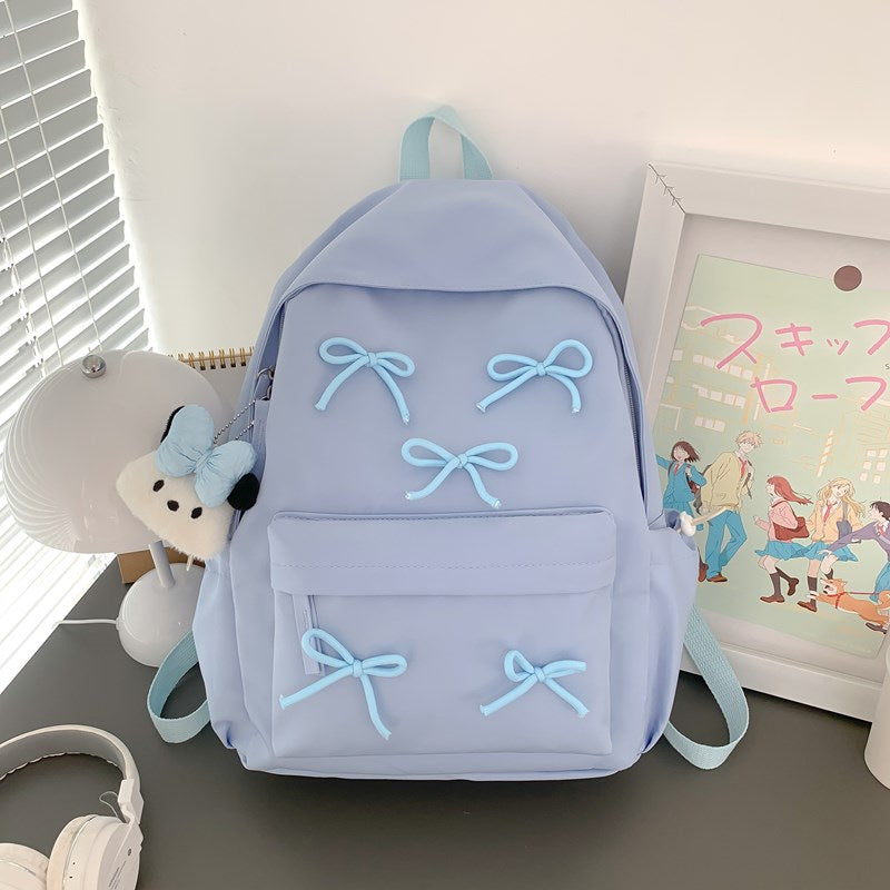 Stylish women's everyday backpack in chic design, functional for travel, school, & casual outings. Playful & trendy.