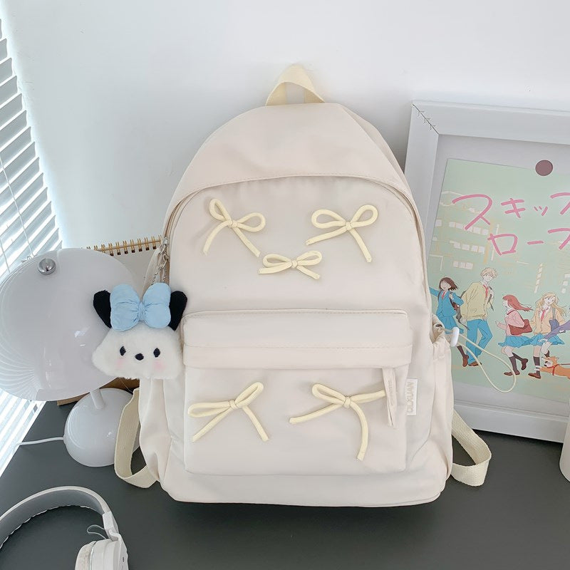Chic women's backpack, playful design, perfect for school, travel, & daily essentials. Stylish & functional accessory.