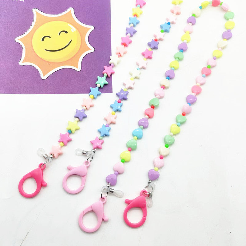 Women's playful necklace with colorful heart & star pendants, perfect accessory.