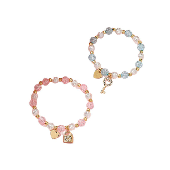 Playful pastel beaded bracelet set for women, adorned with charming heart & key charms. Trendy fashion jewelry.
