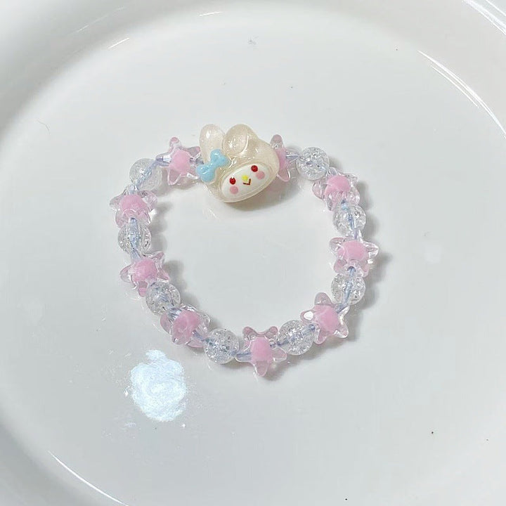 Unique women's bracelet featuring a star pendant and an expressive face charm, adding flair to any outfit.