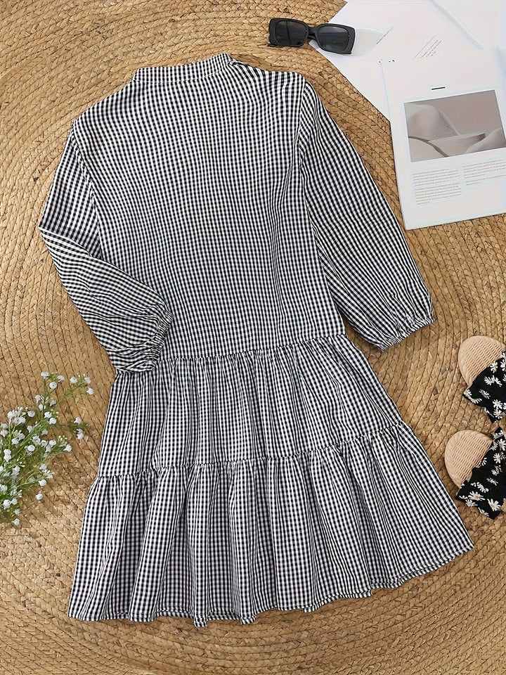 Vibrant striped women's mini dress with cute puffed sleeves, a playful tiered design for summer fun.