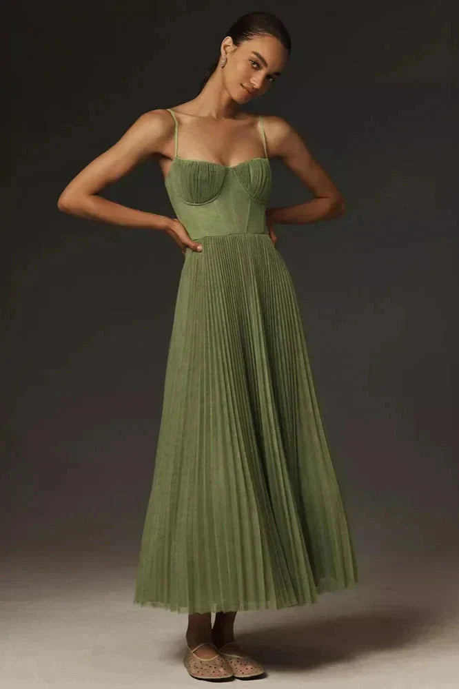 Women's pleated A-line midi dress with elegant bustier top & spaghetti straps, perfect for summer cocktails.