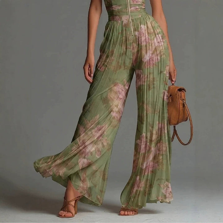 Chic women's sleeveless pleated jumpsuit with a mock neck & wide legs. Great for holiday and casual wear.