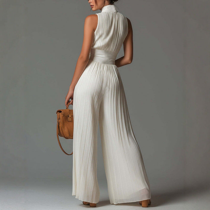 Flowy women's pleated mock neck wide leg jumpsuit. Sleeveless & elegant for any occasion.
