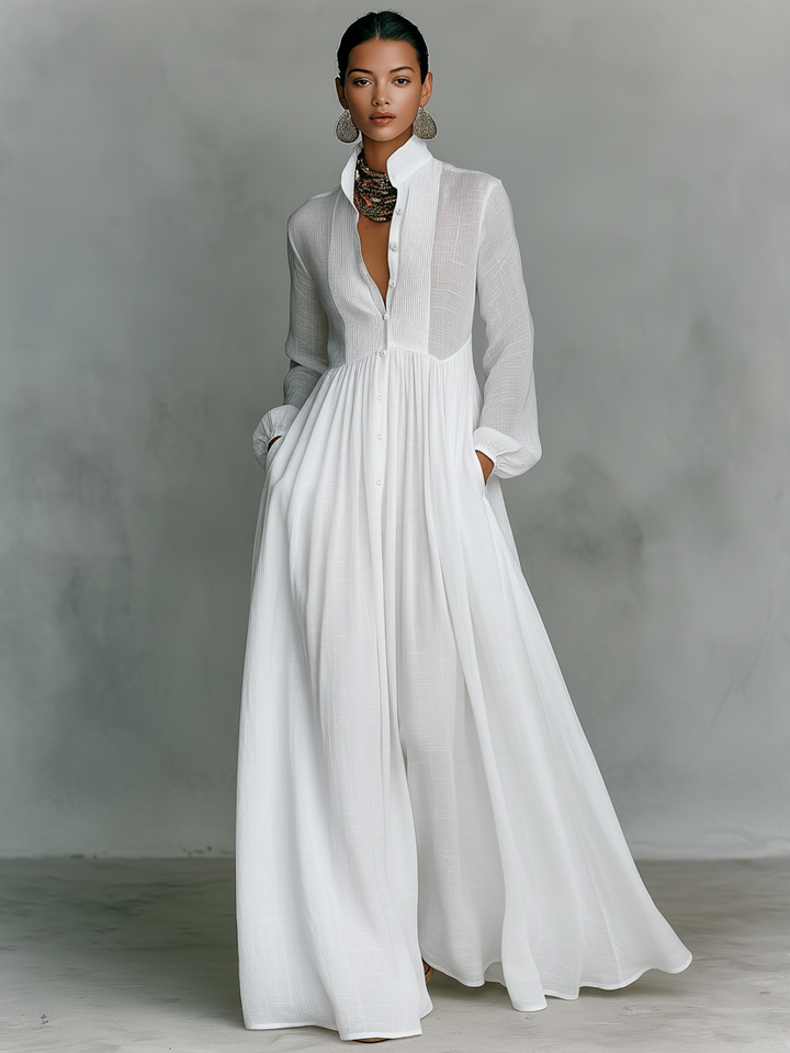 Stylish women's long sleeve pleated maxi dress. Pintuck detail, button front, relaxed fit for elegant casual wear.