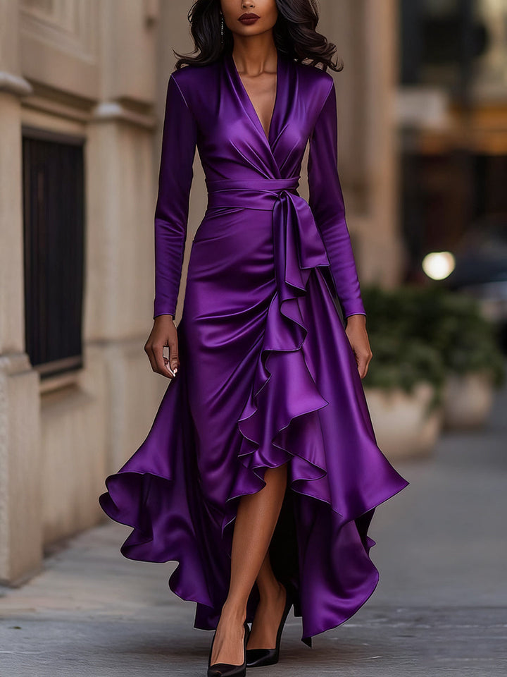Detail of the flattering wrap style on a women's elegant pleated long sleeve maxi dress, perfect for evenings.
