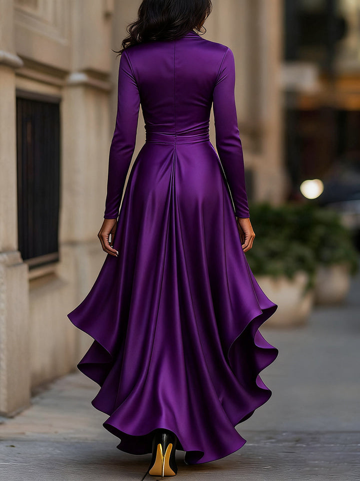 Beautiful women's occasion dress: a pleated ruffle maxi in a rich jewel tone, embodying evening elegance.