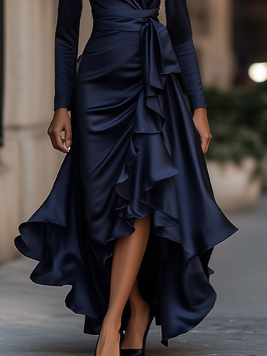 Close-up of the intricate pleats on this women's elegant evening maxi dress with a sophisticated ruffle hem.