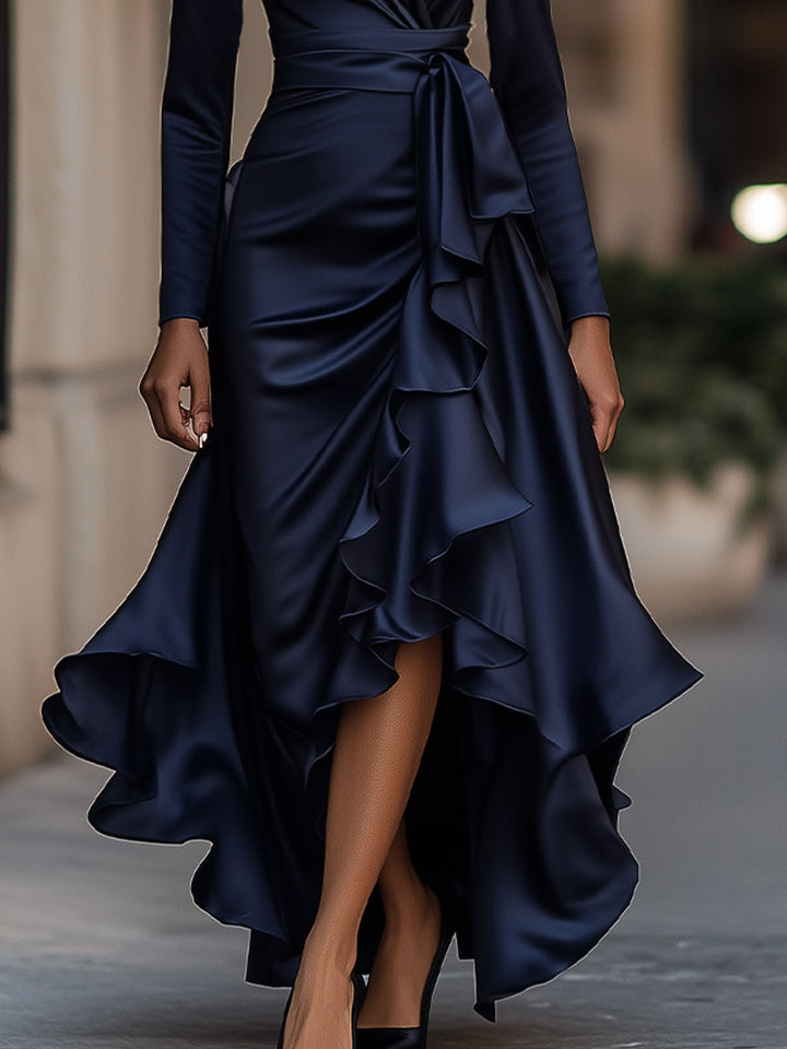 Close-up of the intricate pleats on this women's elegant evening maxi dress with a sophisticated ruffle hem.